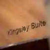 A close up of a sign saying 'Kingsley Suite'