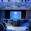 Tables and a projector screen set up in Kinglsey Suite