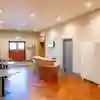 A modern reception desk outside of a large conference room