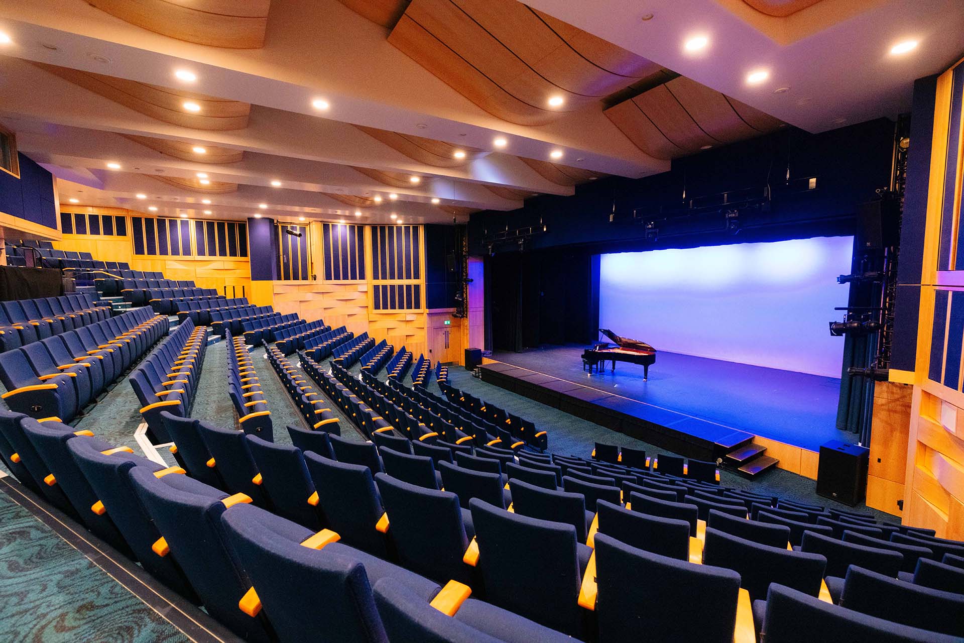 A piano on a stage in Middleton Hall