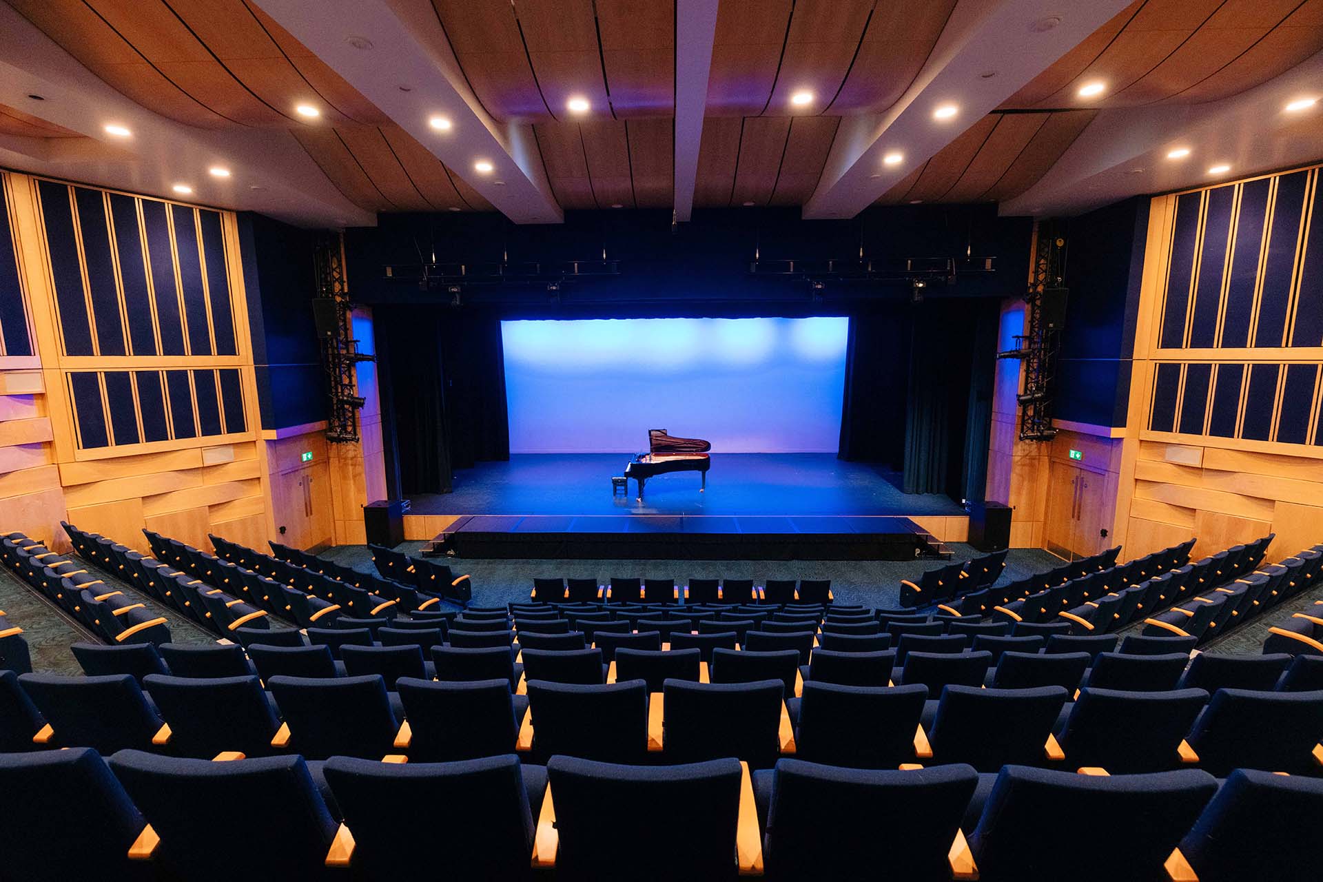 A piano on a stage in Middleton Hall