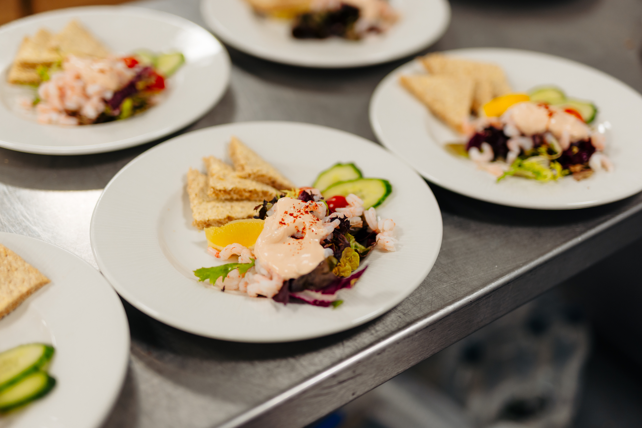 Rows of a prawn cocktail dish plated up