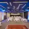 A wide view of many tables set up for dinner in the Kingsley Suite