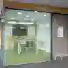 A small enclosed group study room with glass walls