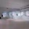 A large exhibition space with portraits on the walls