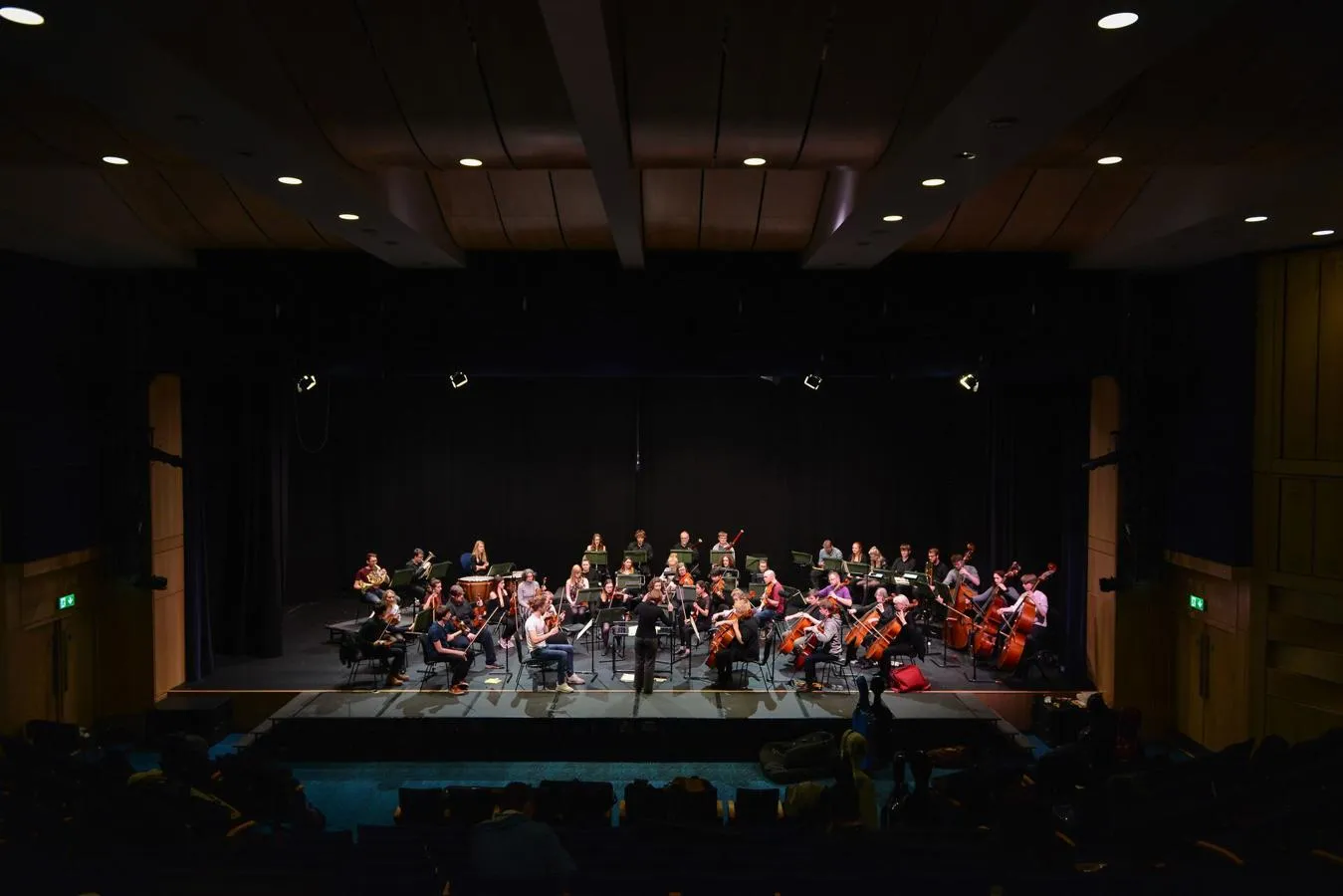 A camerata orchestra rehearses on the large stage in Middleton Hall