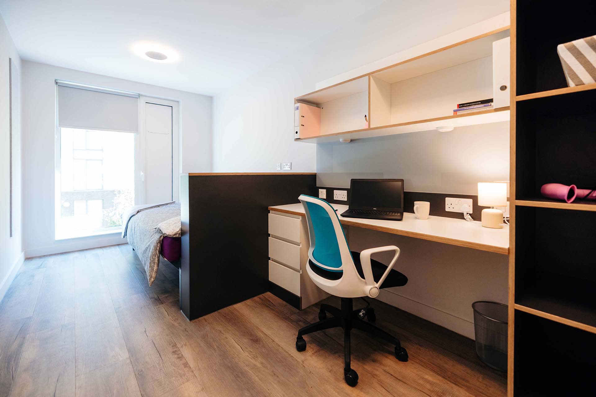 Standard room in Westfield Court with double bed, desk and large wardrobe space